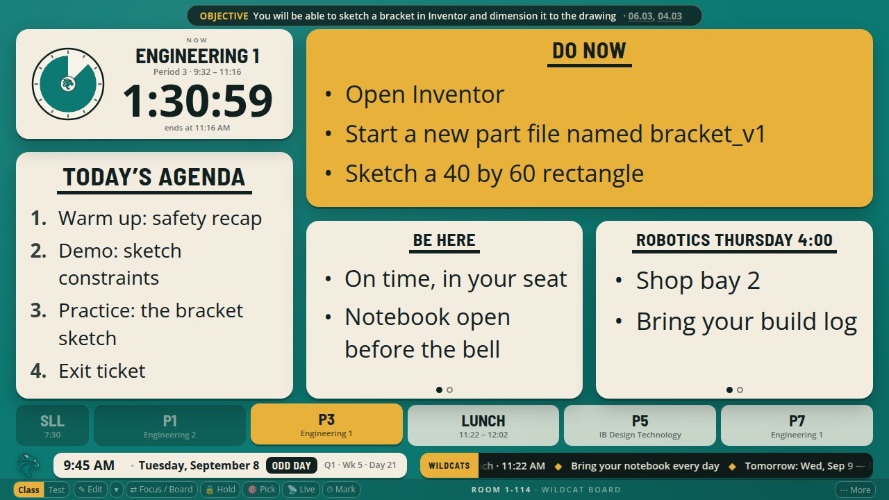 The board with the clock above the agenda on the left, the Do Now top right, and the two tiles under the Do Now.