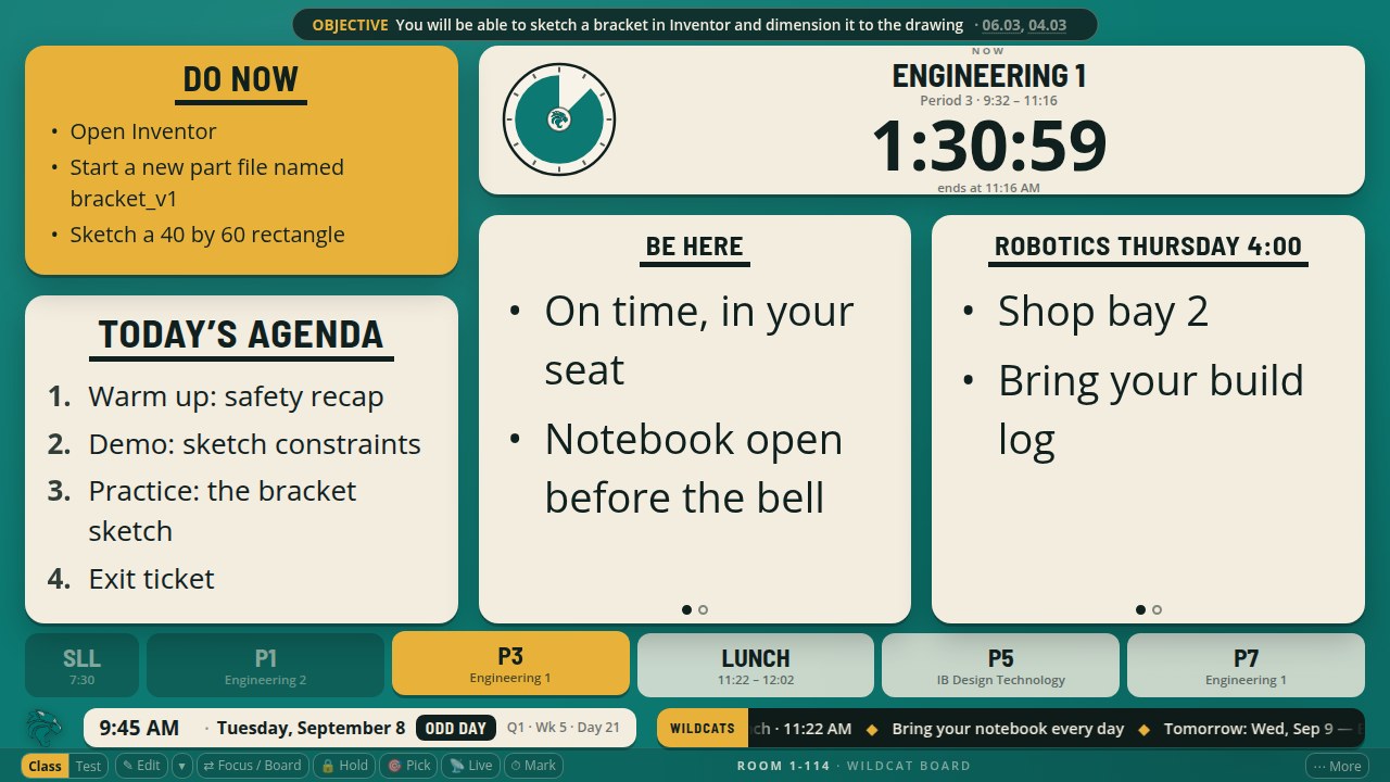 The board with the Do Now over the agenda in the left column, and the clock top right with the two tiles side by side under it.